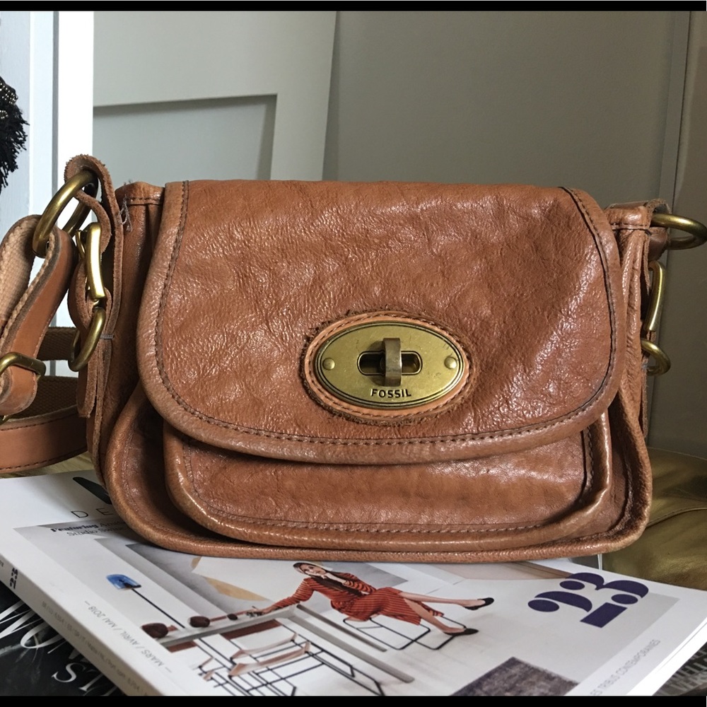 Fossil brand crossbody purse with brass buckle